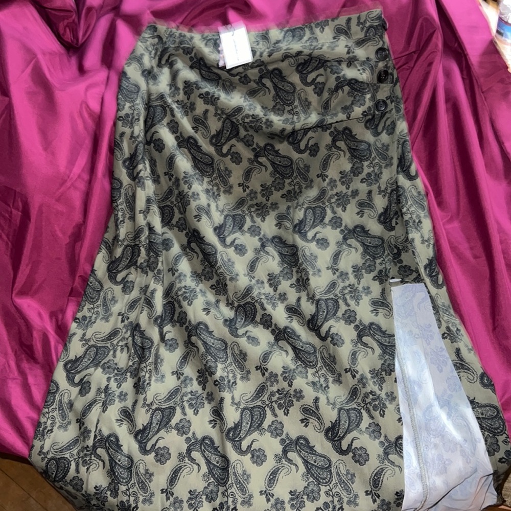 Green skirt with black design small skirt underneath